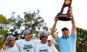 Head coach Nick Clinard of the Auburn Tigers celebrates with the trophy as his team looks on after defeating the Florida State Seminoles in the championship match during the Division I Men’s Golf Championship held at Omni La Costa Resort & Spa on May 29, 2024 in Carlsbad, California. (Photo by C. Morgan Engel/NCAA Photos via Getty Images)